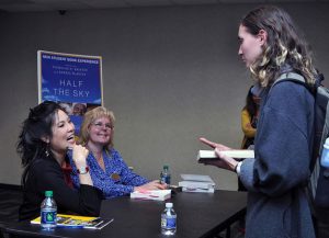 Author Sheryl WuDunn greets  a UMBC Student at the NSBE 2017 book signing.