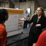 A young student presenting her research at a symposium